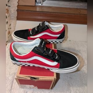 Red, White And Black Checker board Vans Shoes.